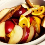 This house will smell like fall soon. Apple juice, apple slices, orange slices, cinnamon, and cloves cooking in a crockpot. This was obviously my idea.